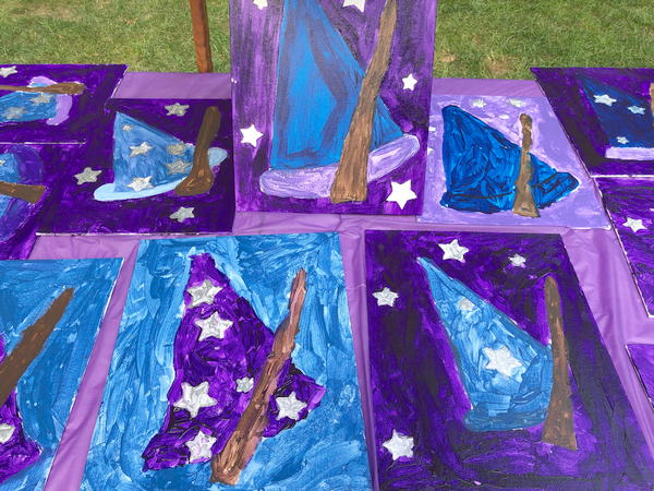 purple and blue paintings of wizard hats